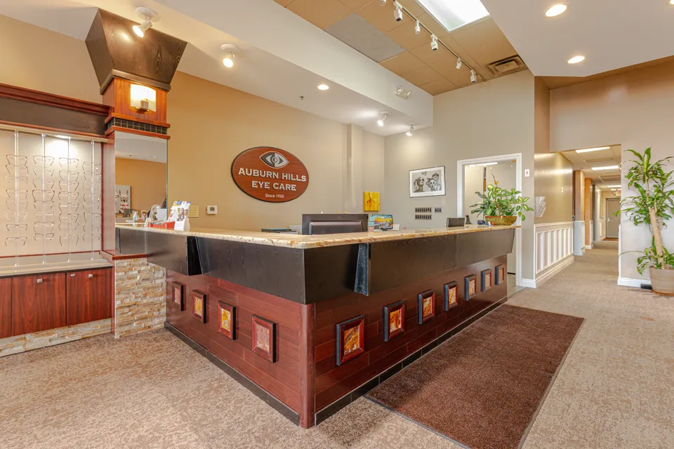 Reception desk and office sign inside Auburn Hills Eye Care